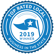 A blue and white seal that says `` top rated local business in the state ''.