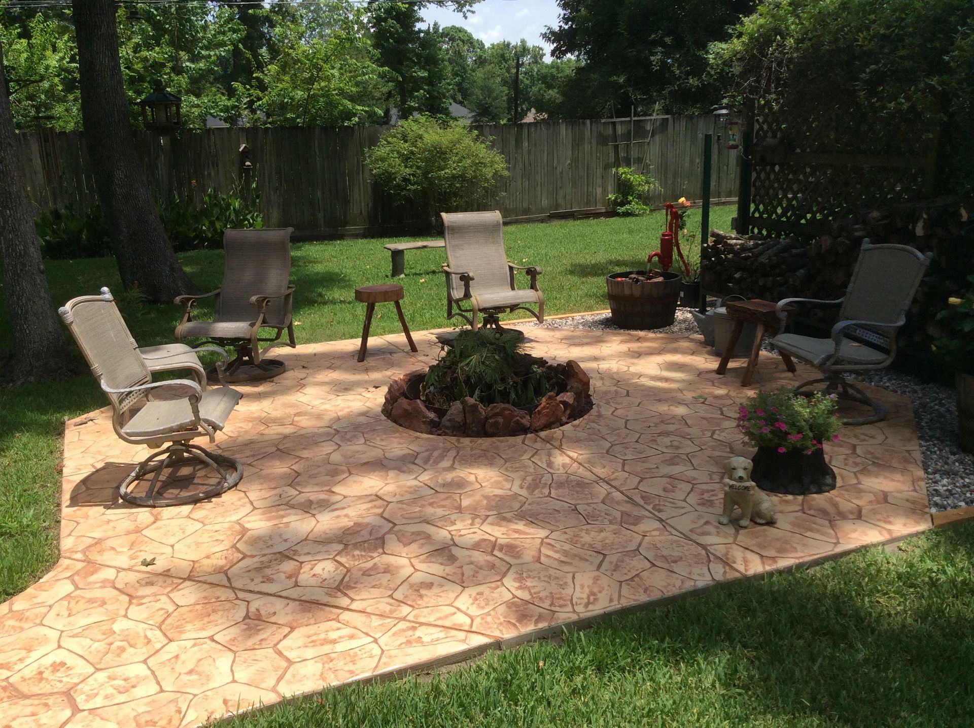 There is a fire pit in the middle of the patio.