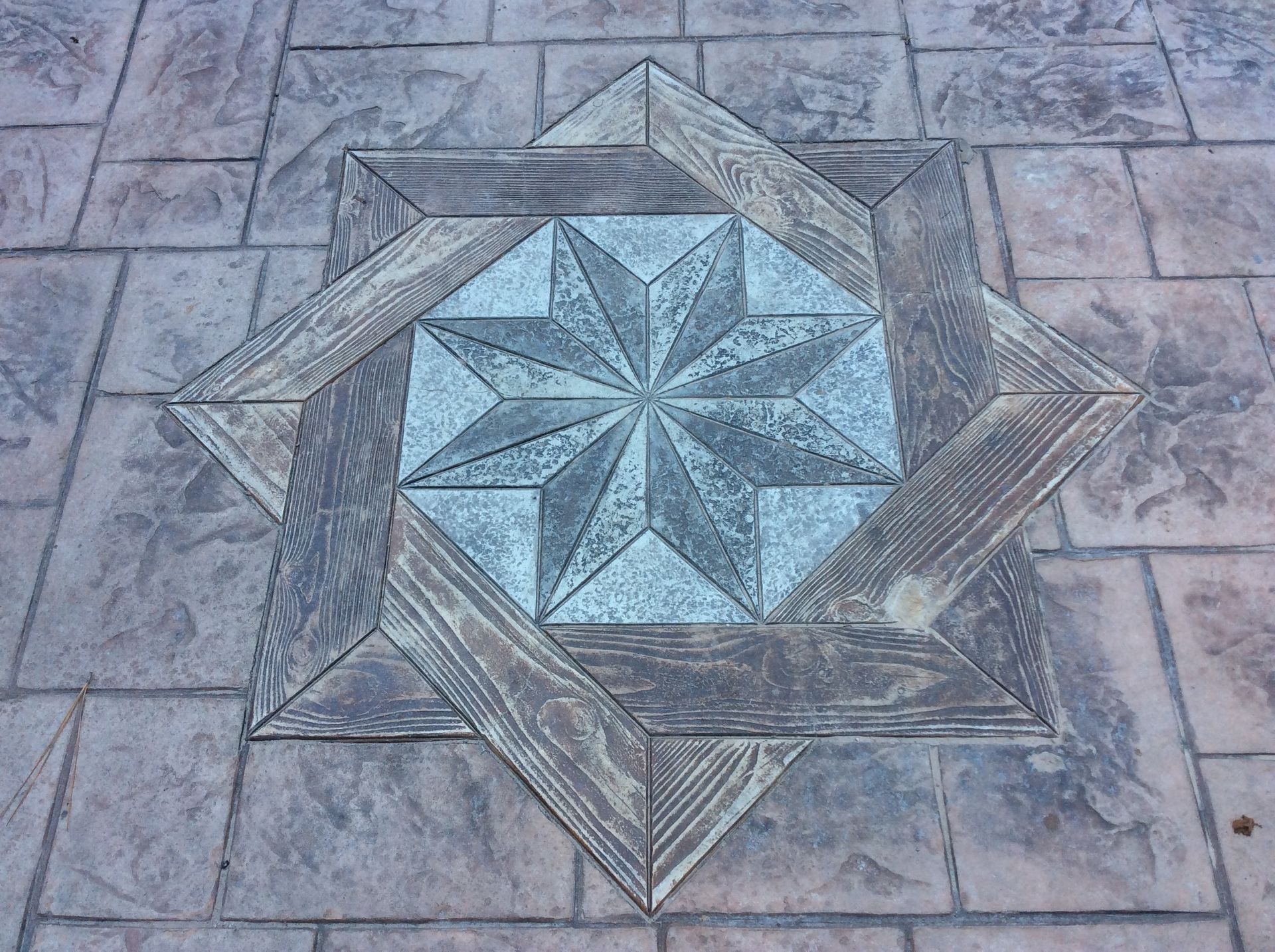 A concrete floor with a star in the middle of it