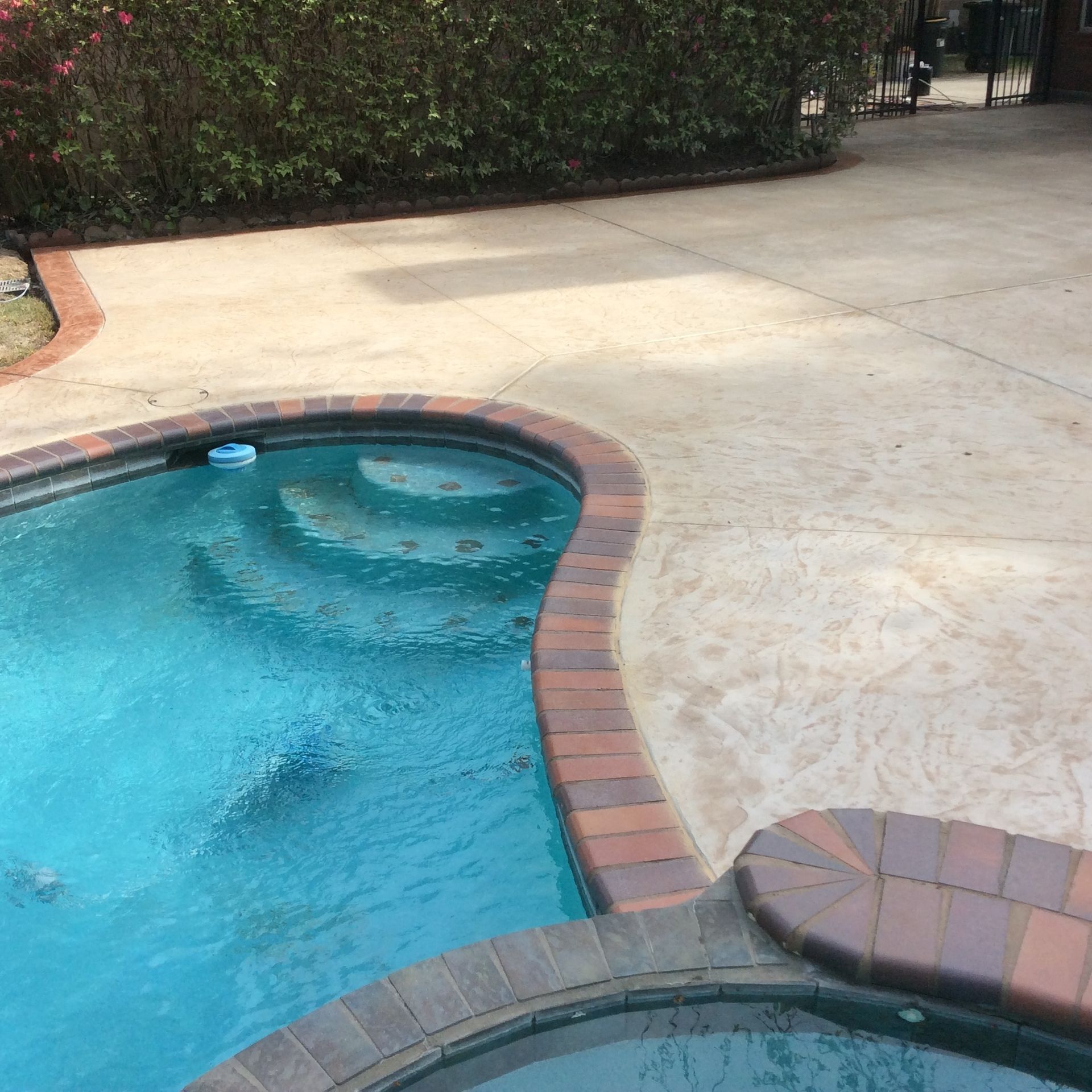 A large swimming pool with steps leading to it