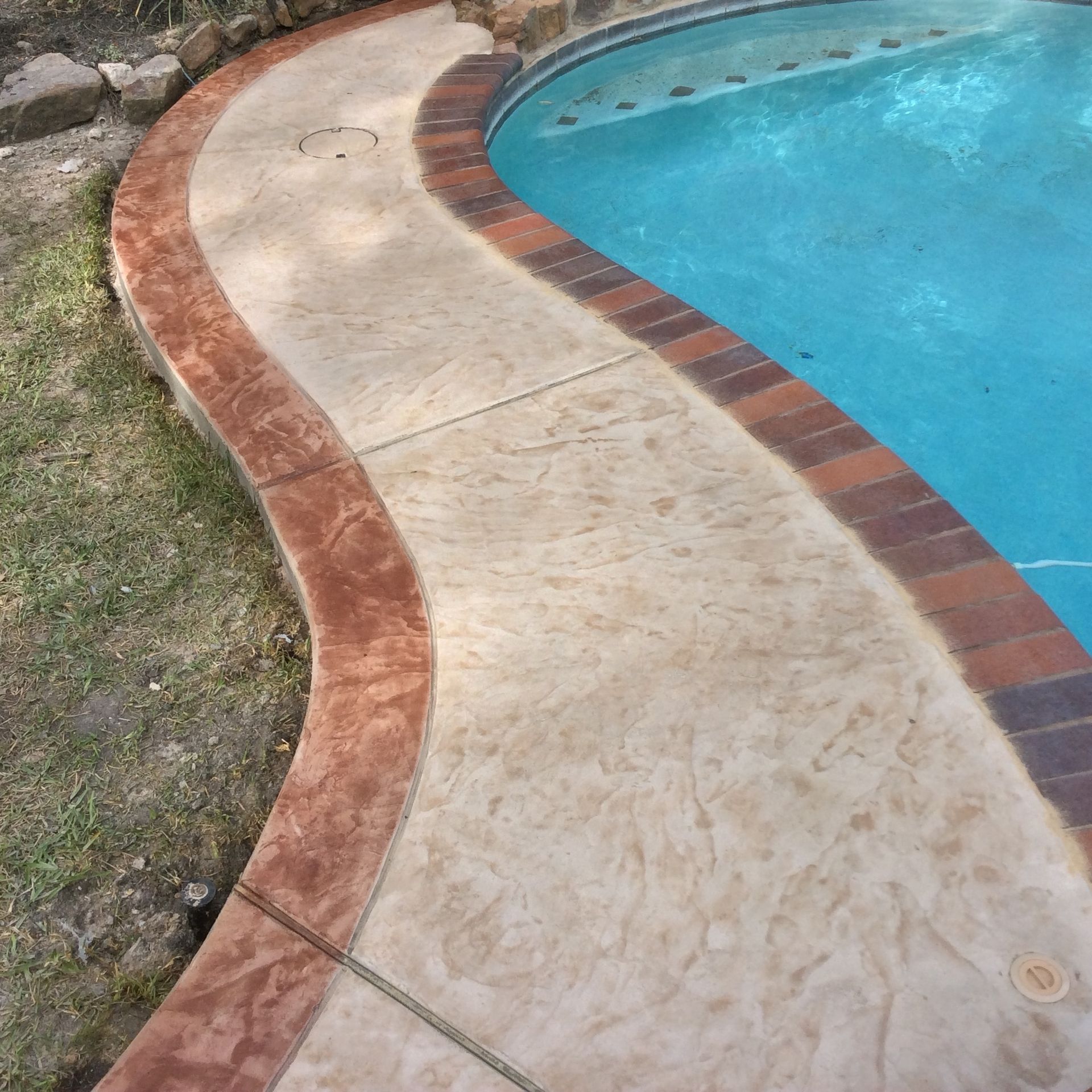 A swimming pool with a walkway leading to it