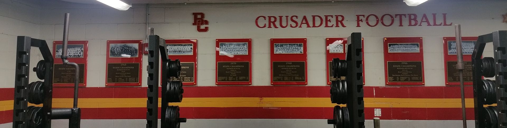 Weight racks in a Crusader football team weight room