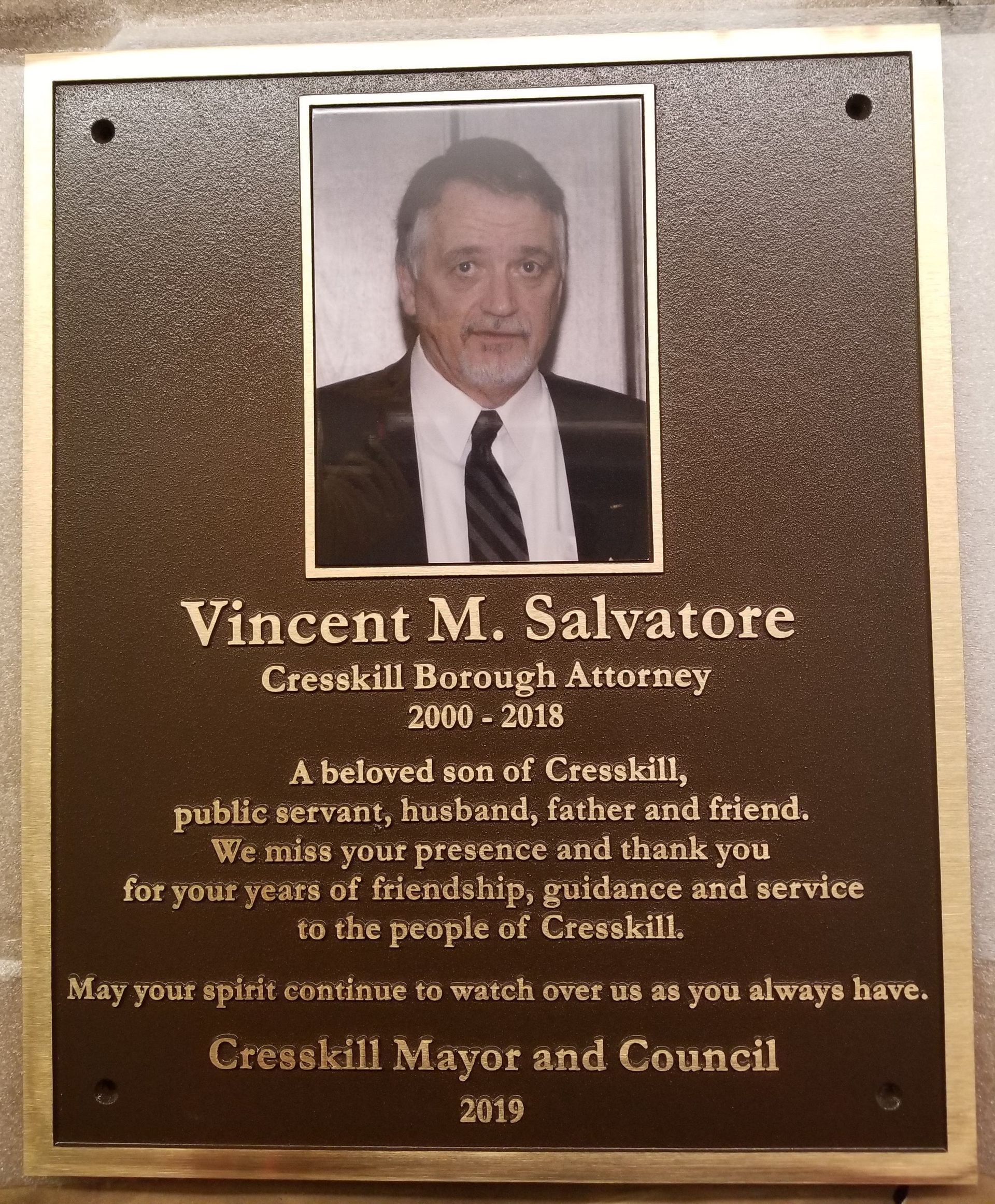 Memorial plaque with photo of Vincent M. Salvatore, Cresskill Borough Attorney (2009-2018). Bronze plaque, gold trim