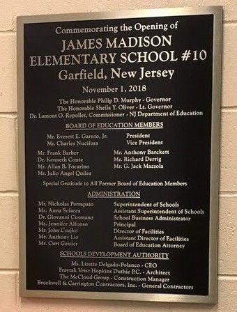 Plaque commemorating the opening of James Madison Elementary School #10 in Garfield, NJ, listing names and titles