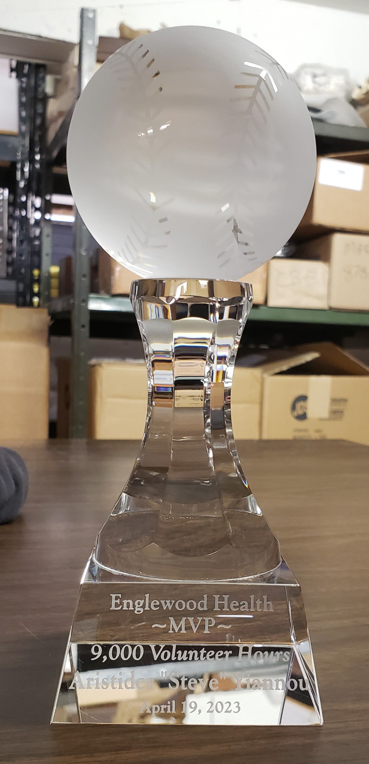 Crystal trophy with a globe top and inscribed base