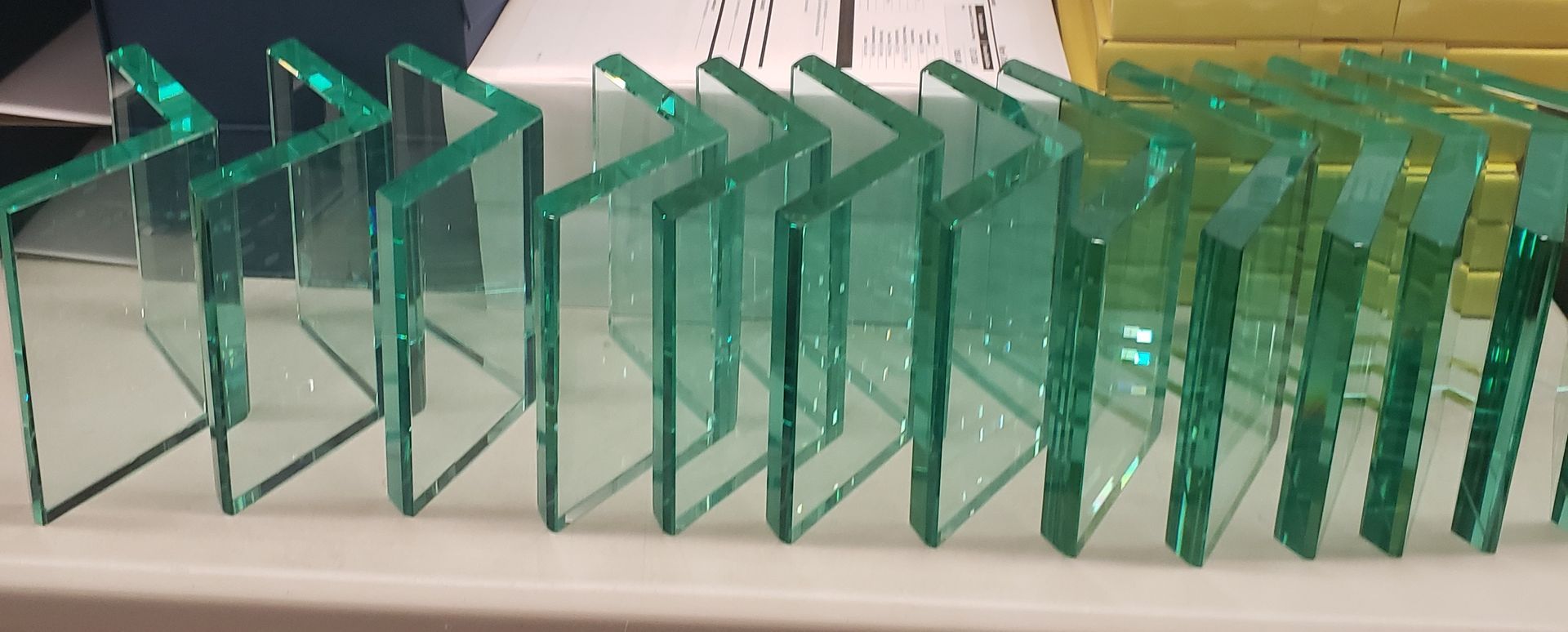 Glass L-shaped shelves on a white surface