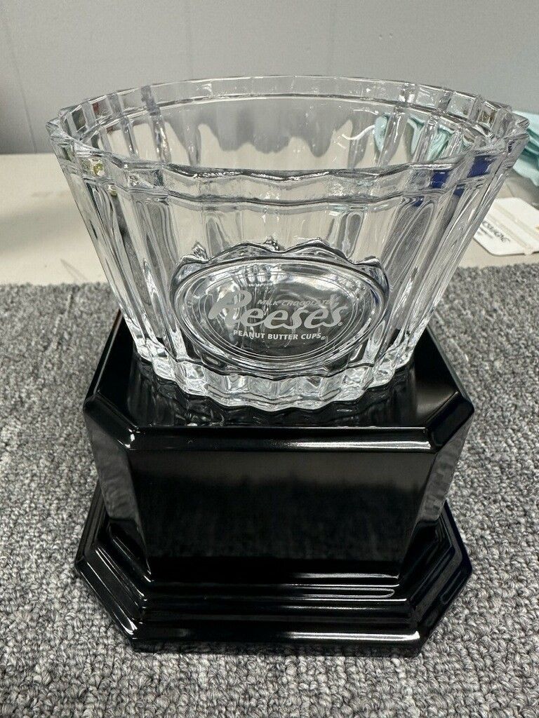 Clear glass trophy bowl on a black, octagonal base