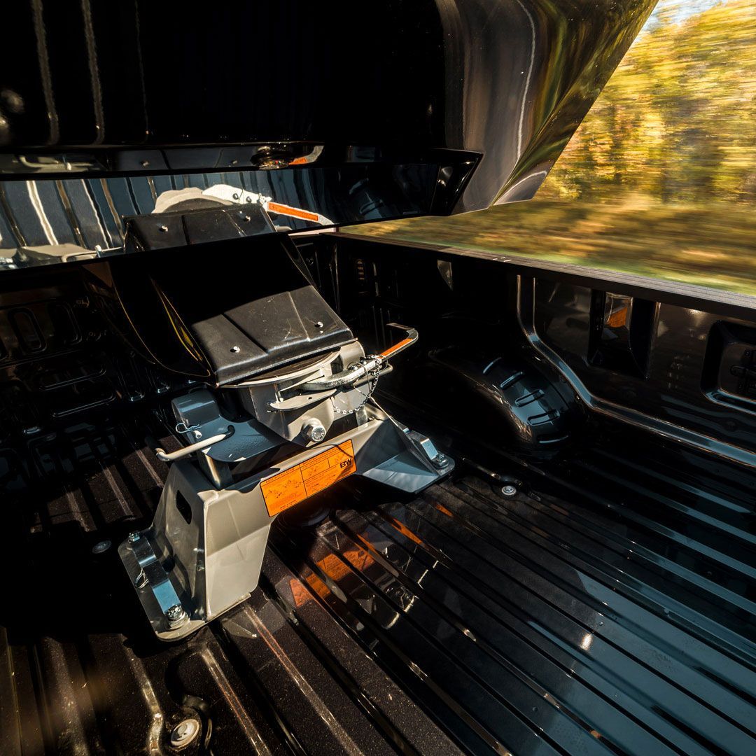 A fifth-wheel hitch installed in the bed of a pickup truck.