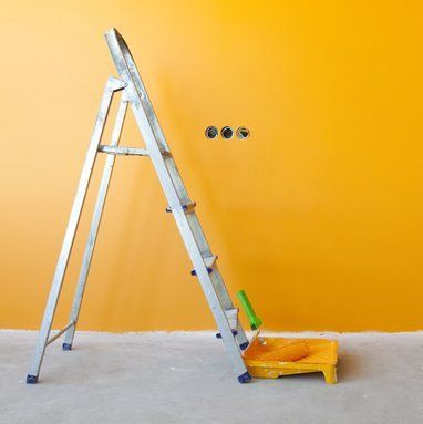 Wall painting with ladder and roller