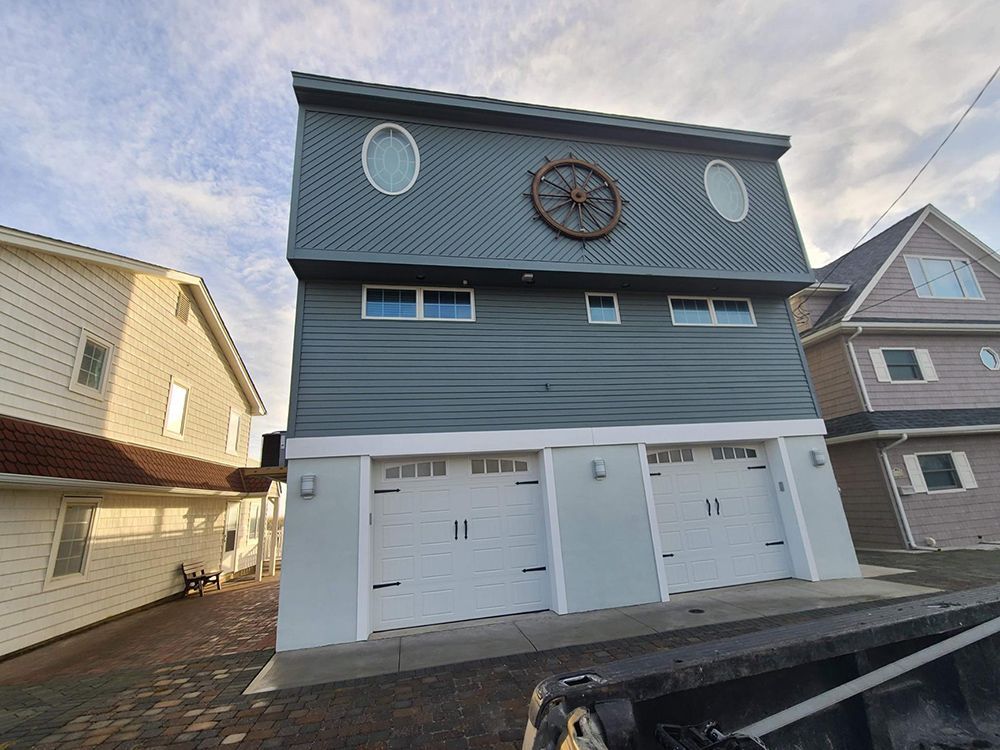 A house with a steering wheel on the top of it