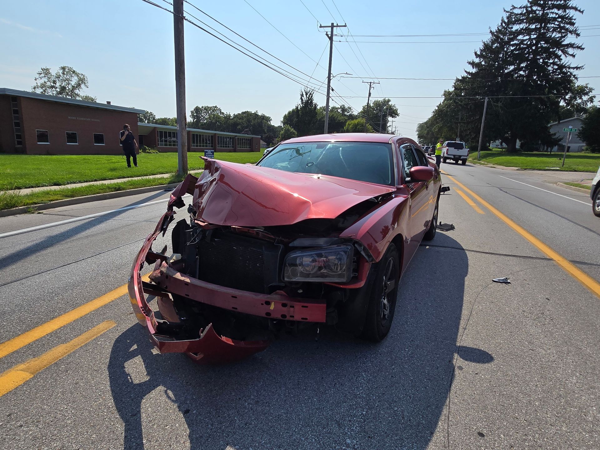 Car accident in Des Moines, Iowa involving damaged vehicles after a collision