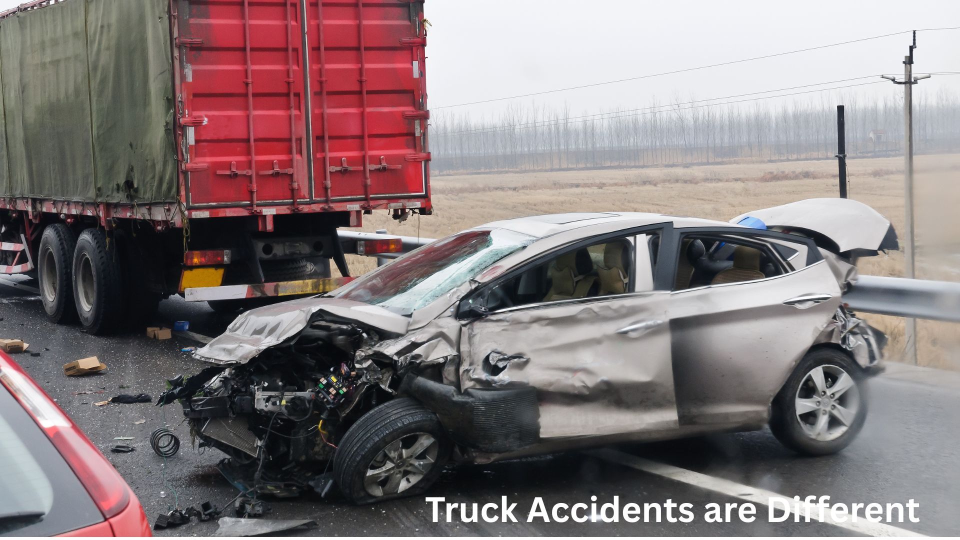 Semi-truck and severely damaged CR-V surrounded by debris after a serious truck accident in Iowa.