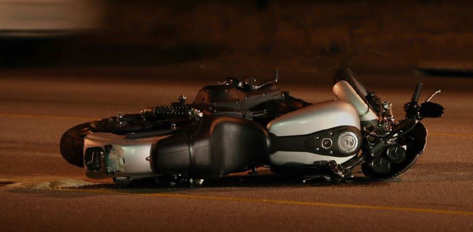 Motorcycle laying in the middle of a highway after an accident in West Des Moines, IA