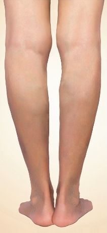 A close up of a person 's legs with a white background.
