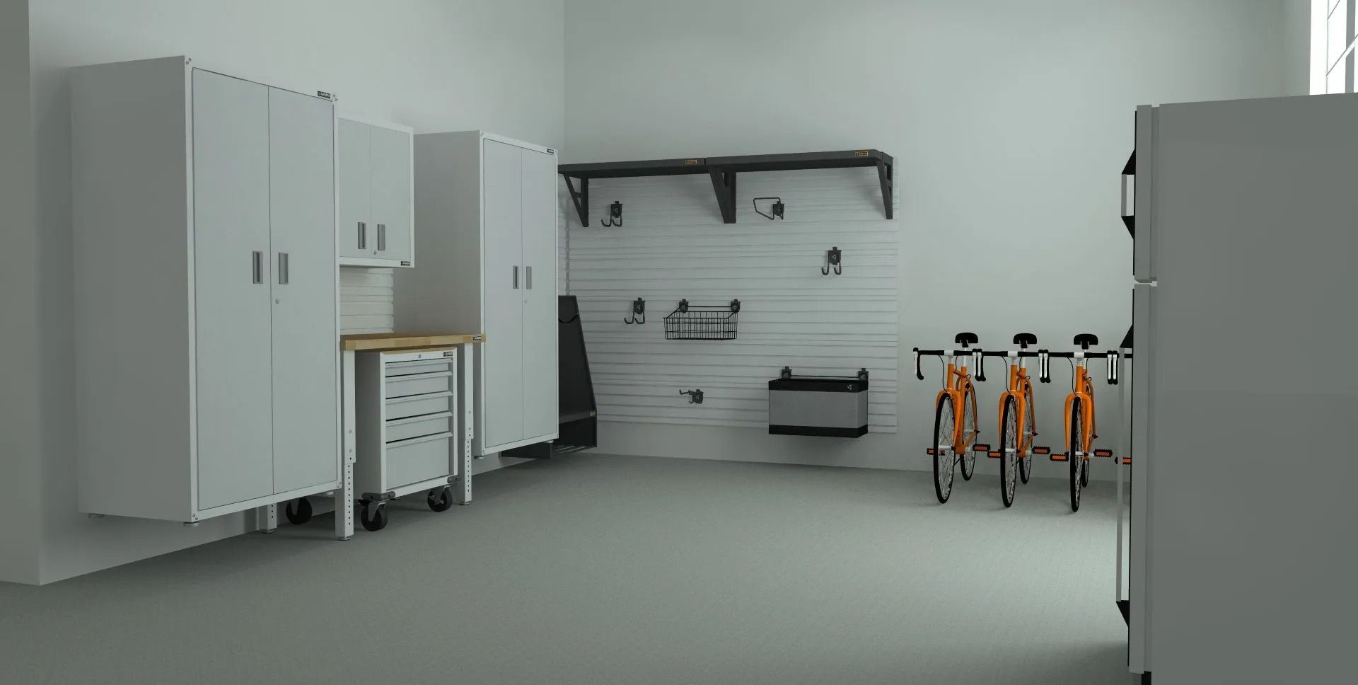 Garage interior with white cabinets, bike rack, and two orange bicycles.