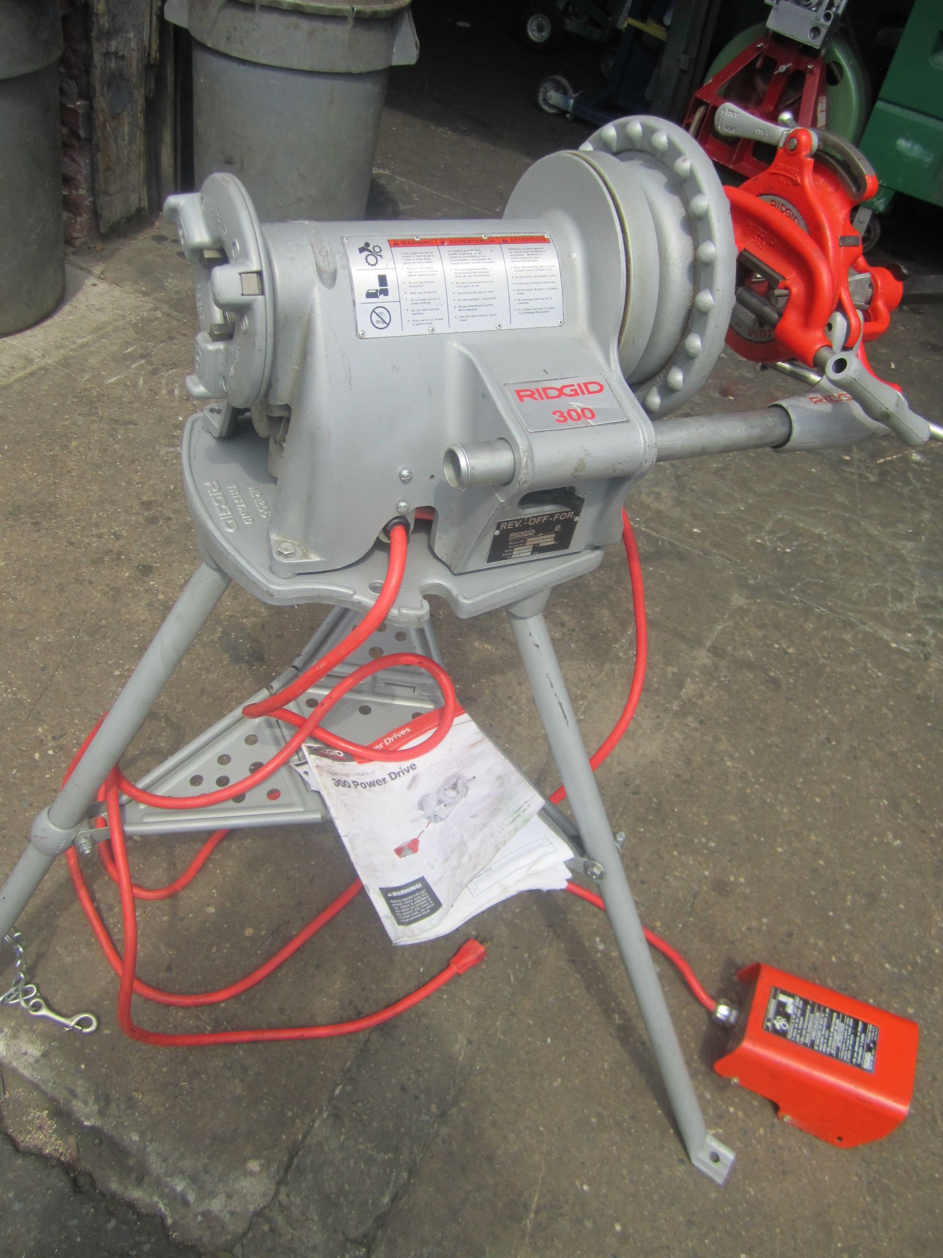 A machine with a red cord coming out of it