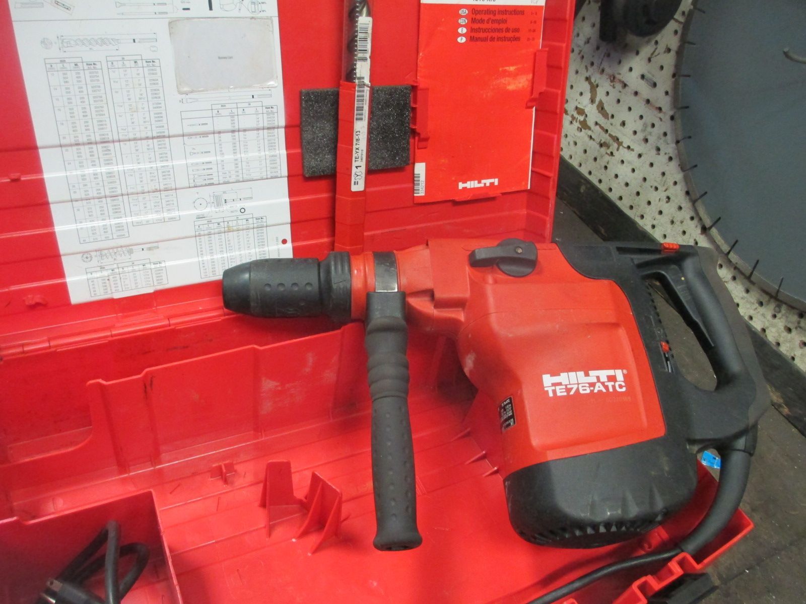 A red hilti hammer drill is in a red case