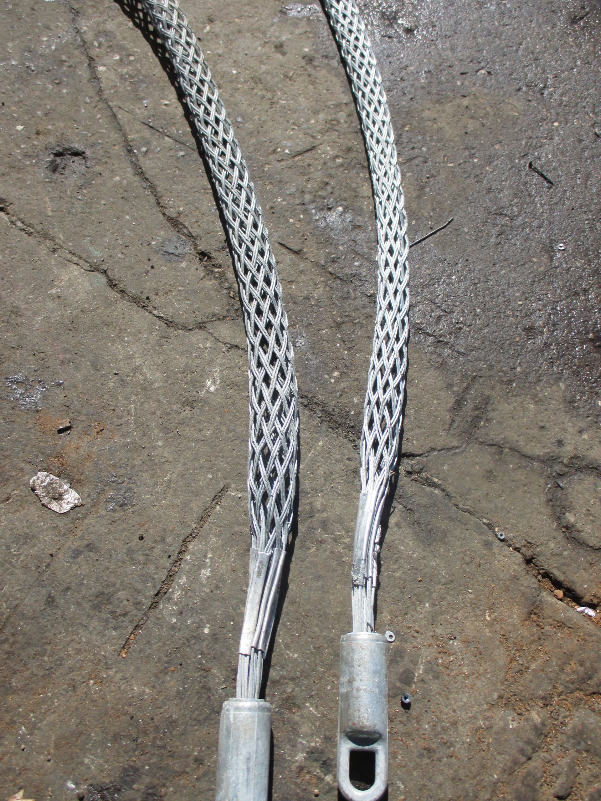 A close up of a metal wire with a hole in the middle