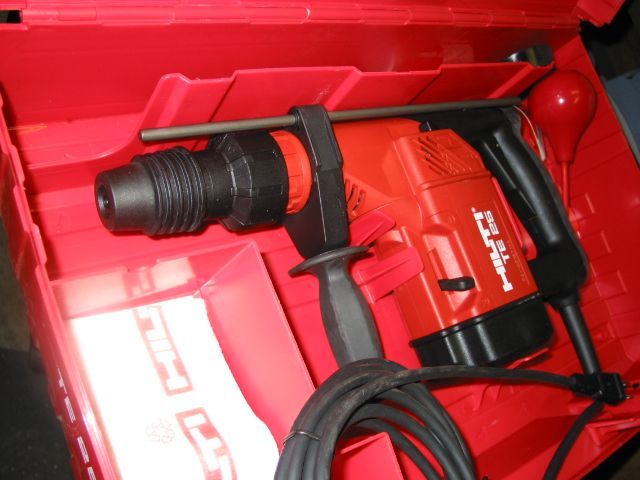 A red hilti hammer is in a red box