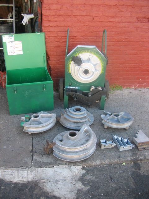 A green box with a sticker on it that says ' a ' on it