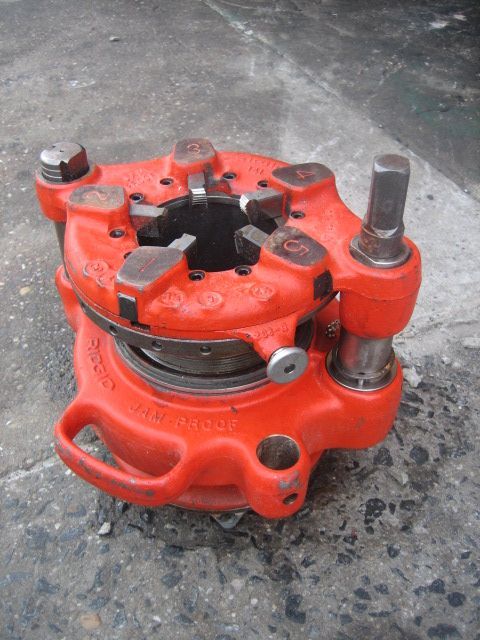 A close up of a red tool that says ' a ' on it