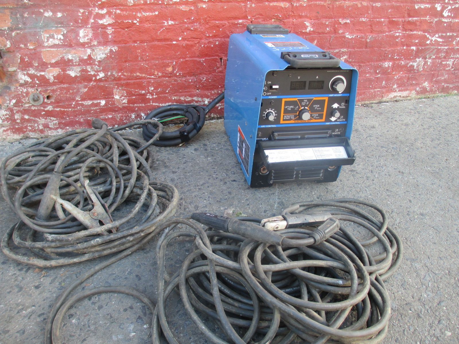 A welding machine with a bunch of wires attached to it