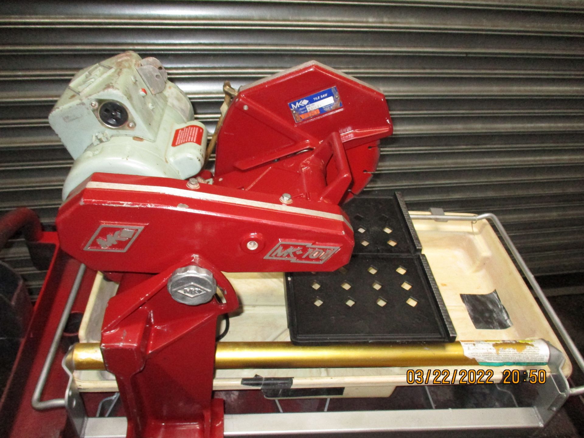 A red and white machine is sitting on a table