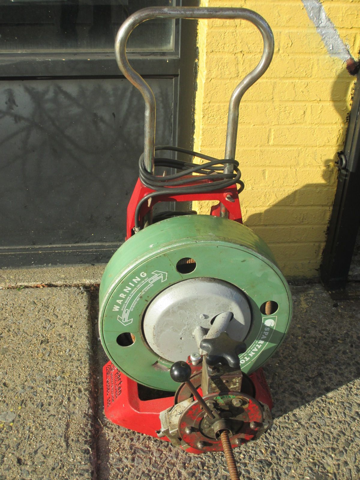 A drain cleaner with a warning label on it