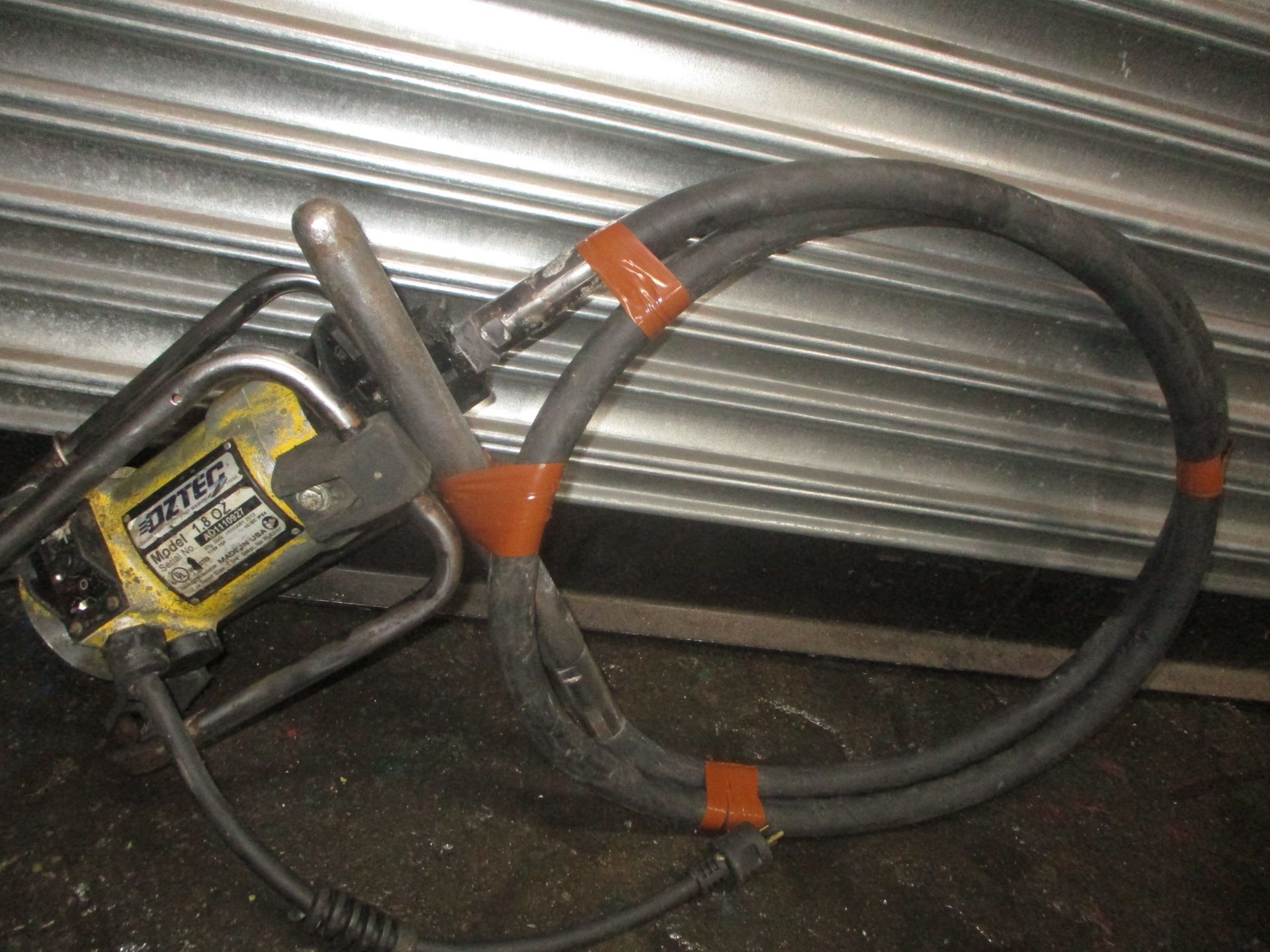 A yellow and black machine with the word mustang on it