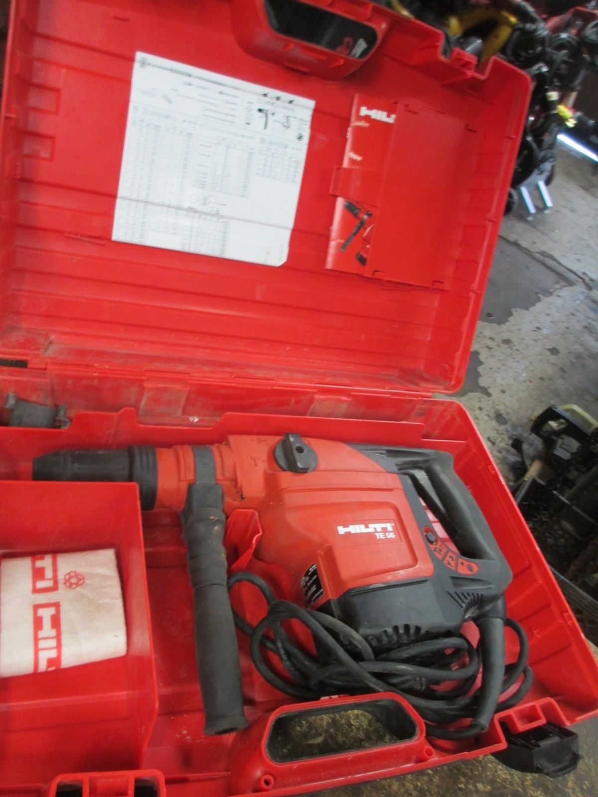 A red case with a hammer inside of it