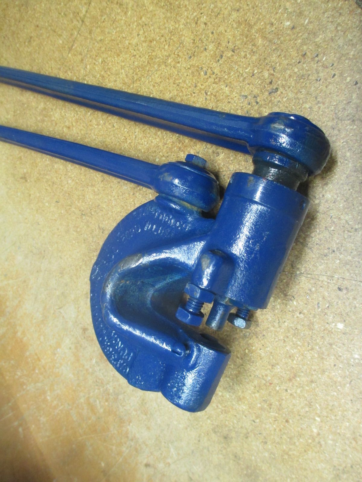 A close up of a blue tool on a table
