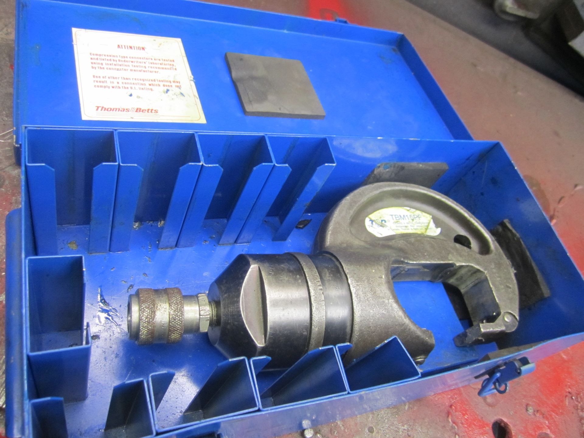 A blue box with a tool inside of it