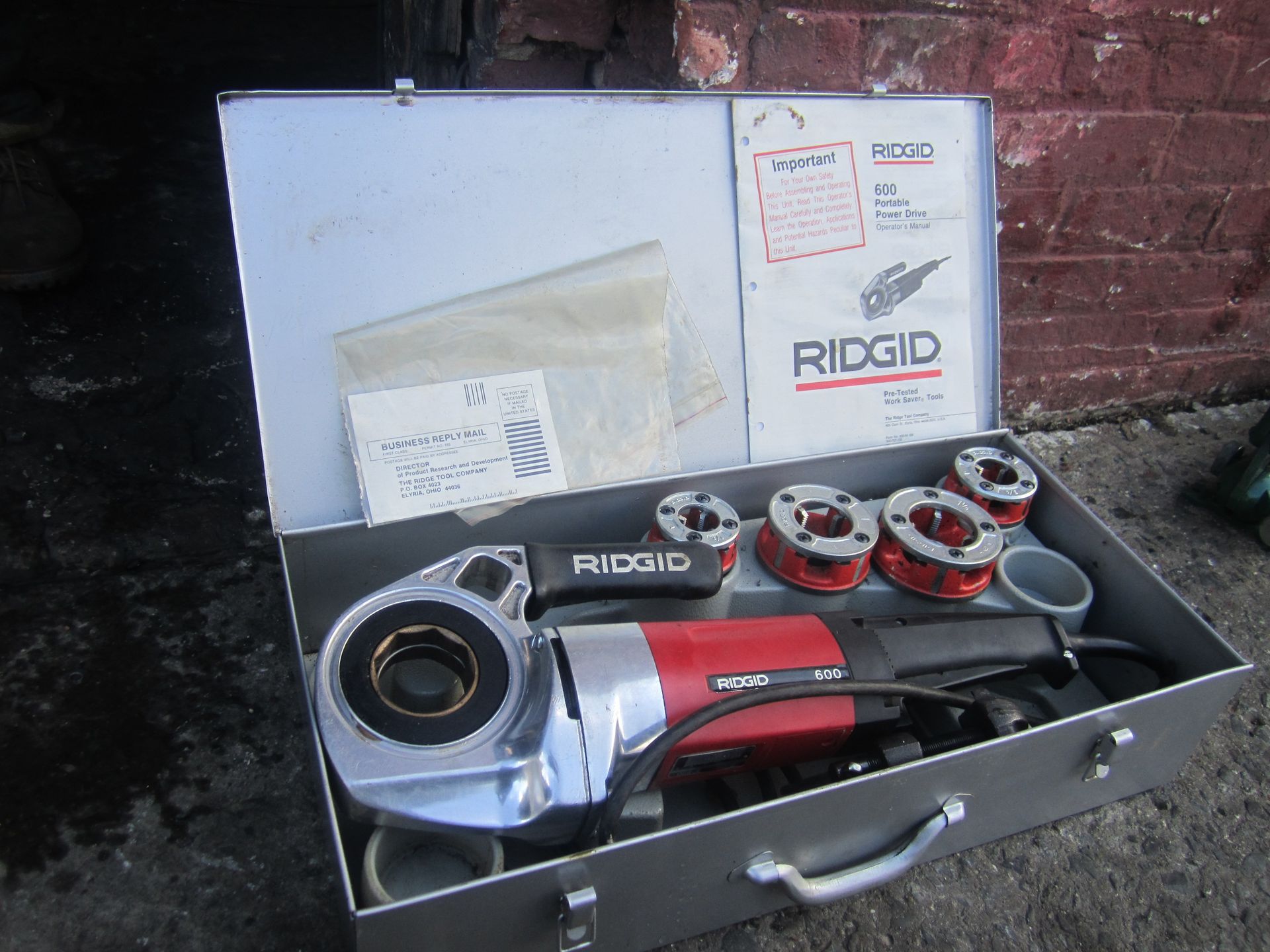 A ridgid tool is in a metal case