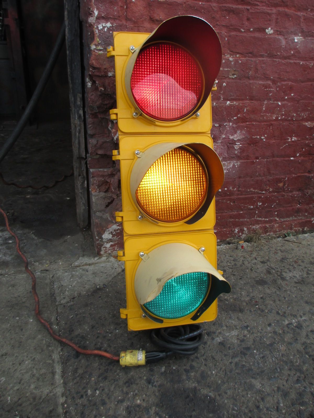 A traffic light with red yellow and green lights