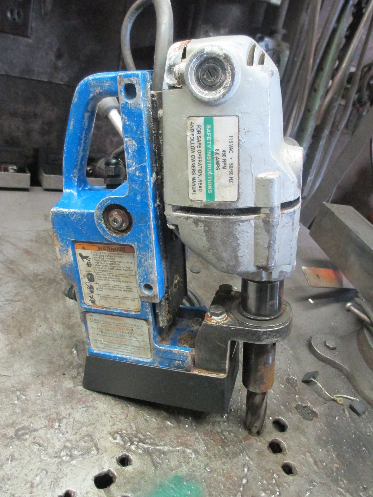 A blue and white machine is sitting on a table.