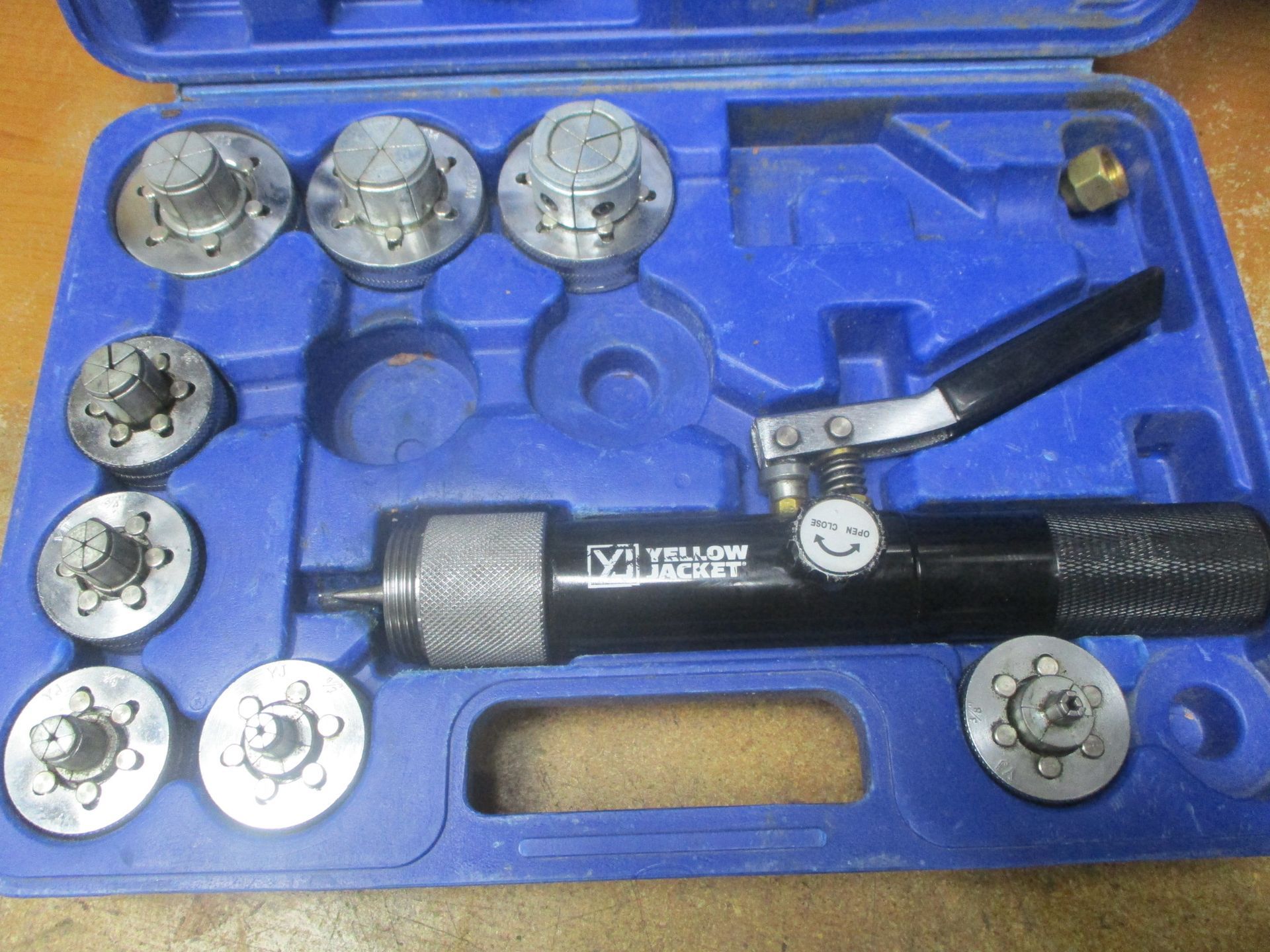 A tool in a blue case that says yellow on it