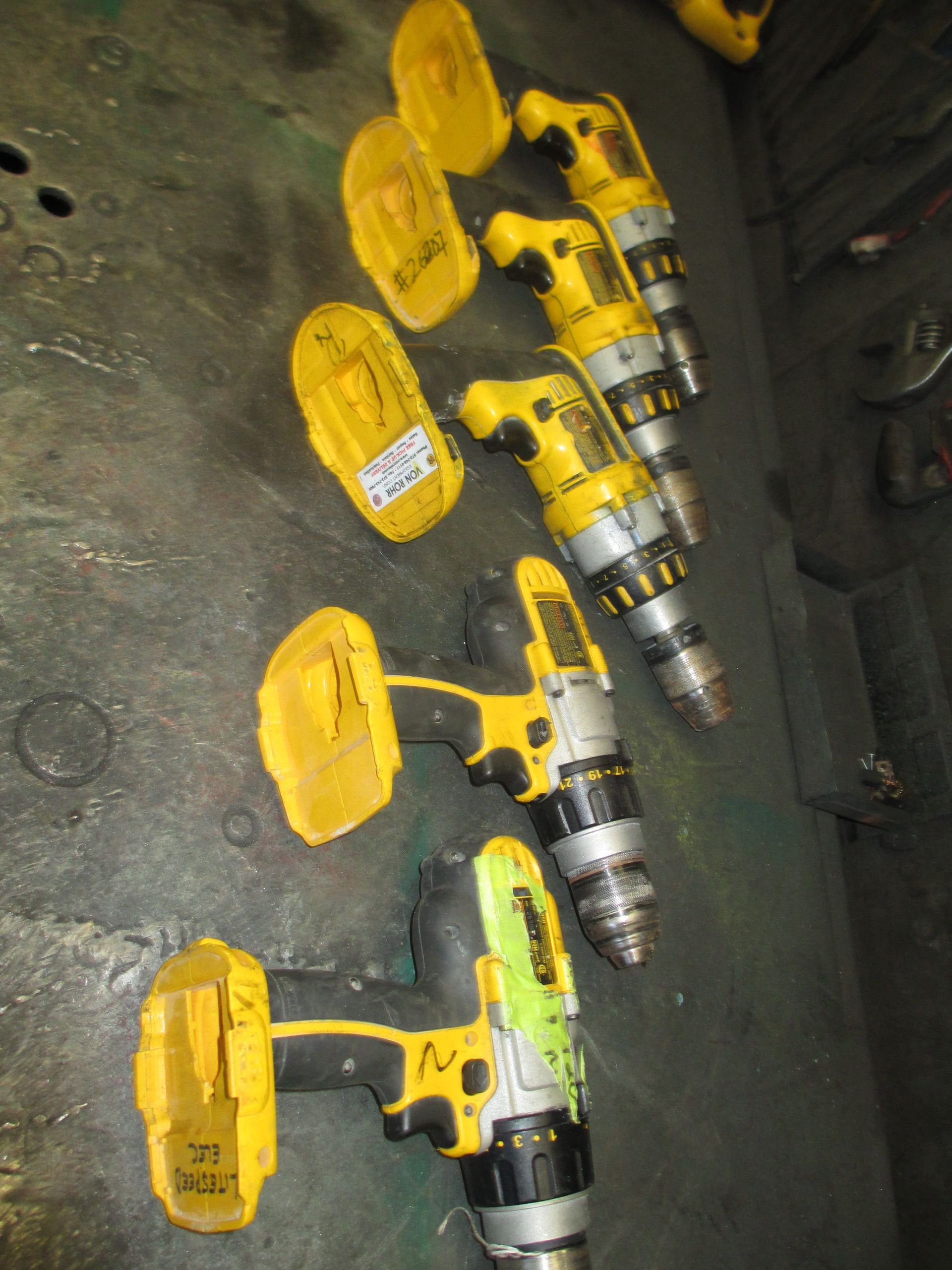 A bunch of dewalt tools are lined up on a table