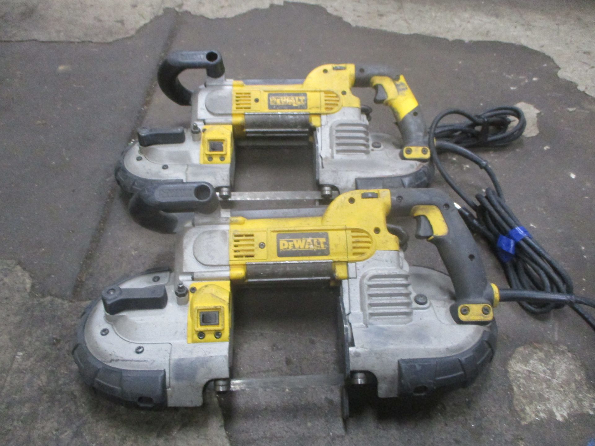 Three dewalt band saws are stacked on top of each other