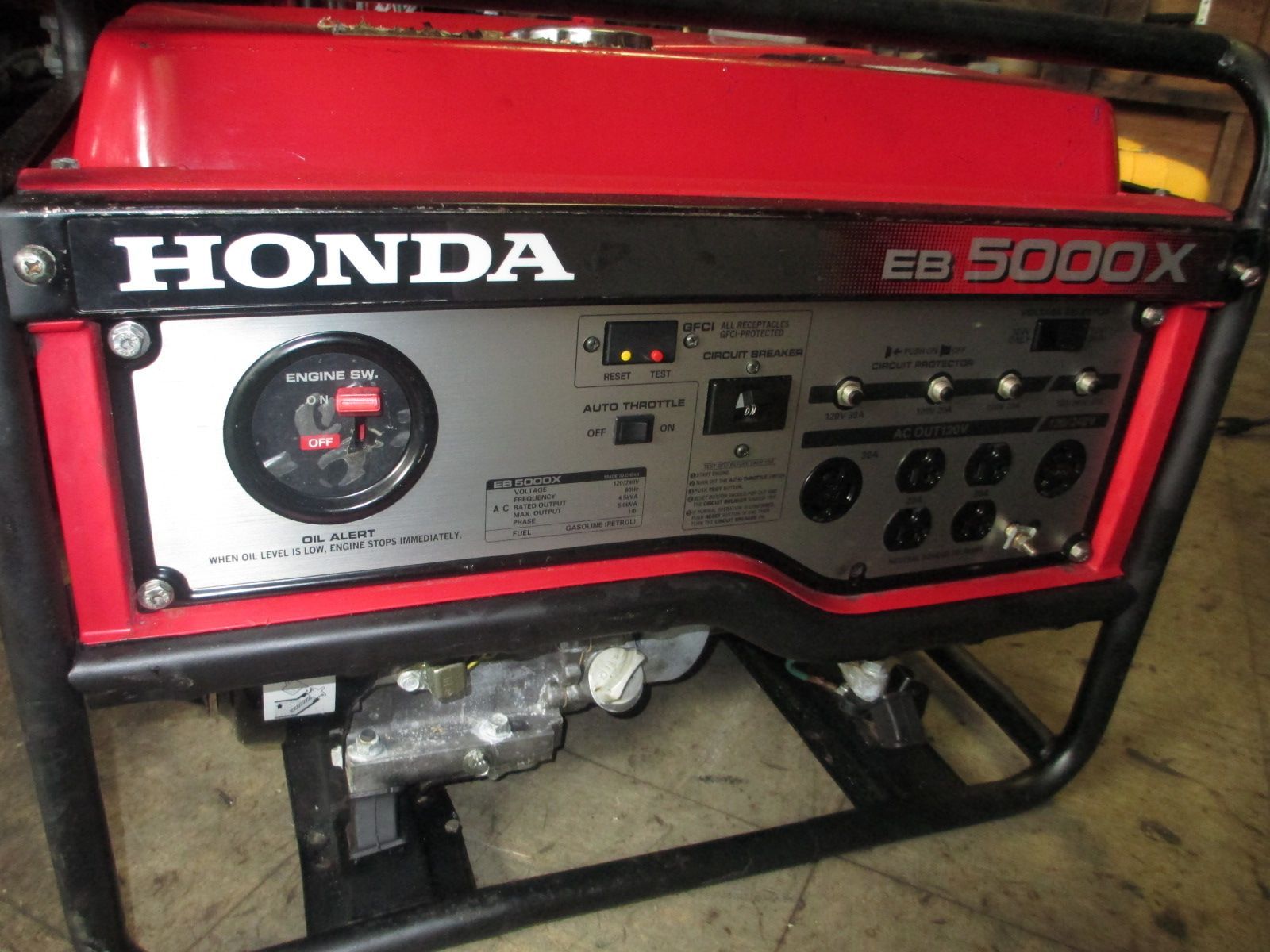 A honda generator is sitting on the ground