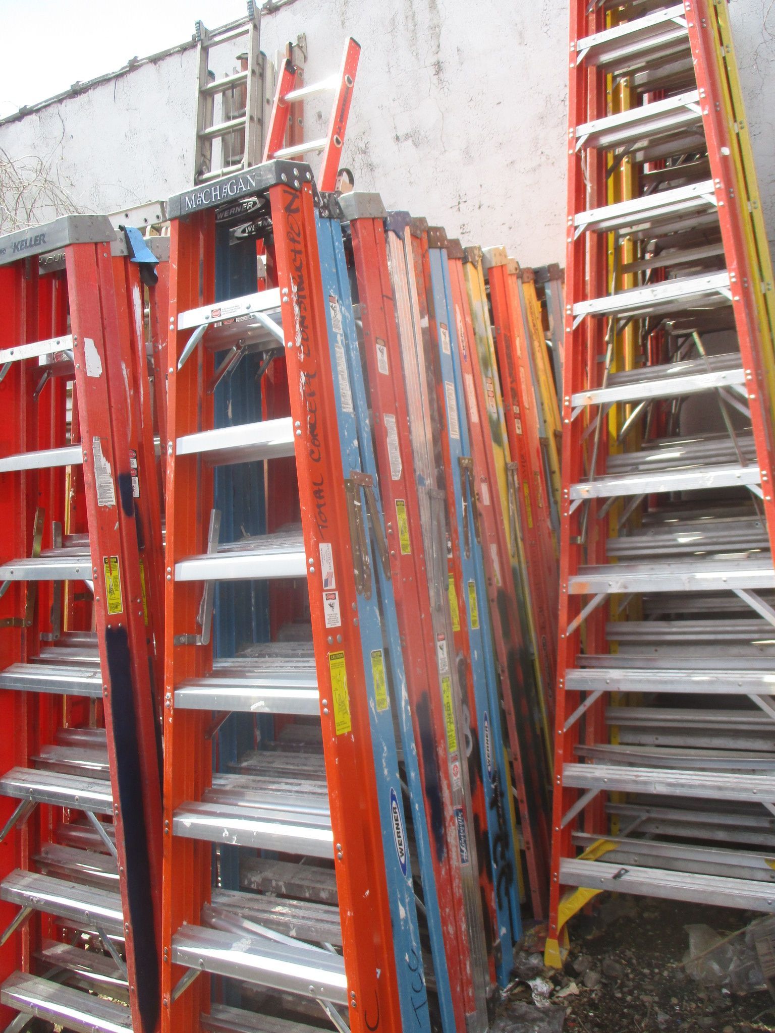 A bunch of ladders are stacked on top of each other