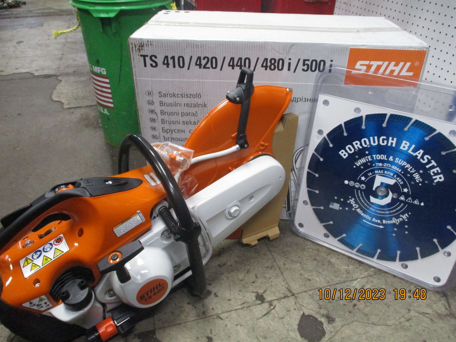 A stihl saw is sitting next to a borough blaster blade