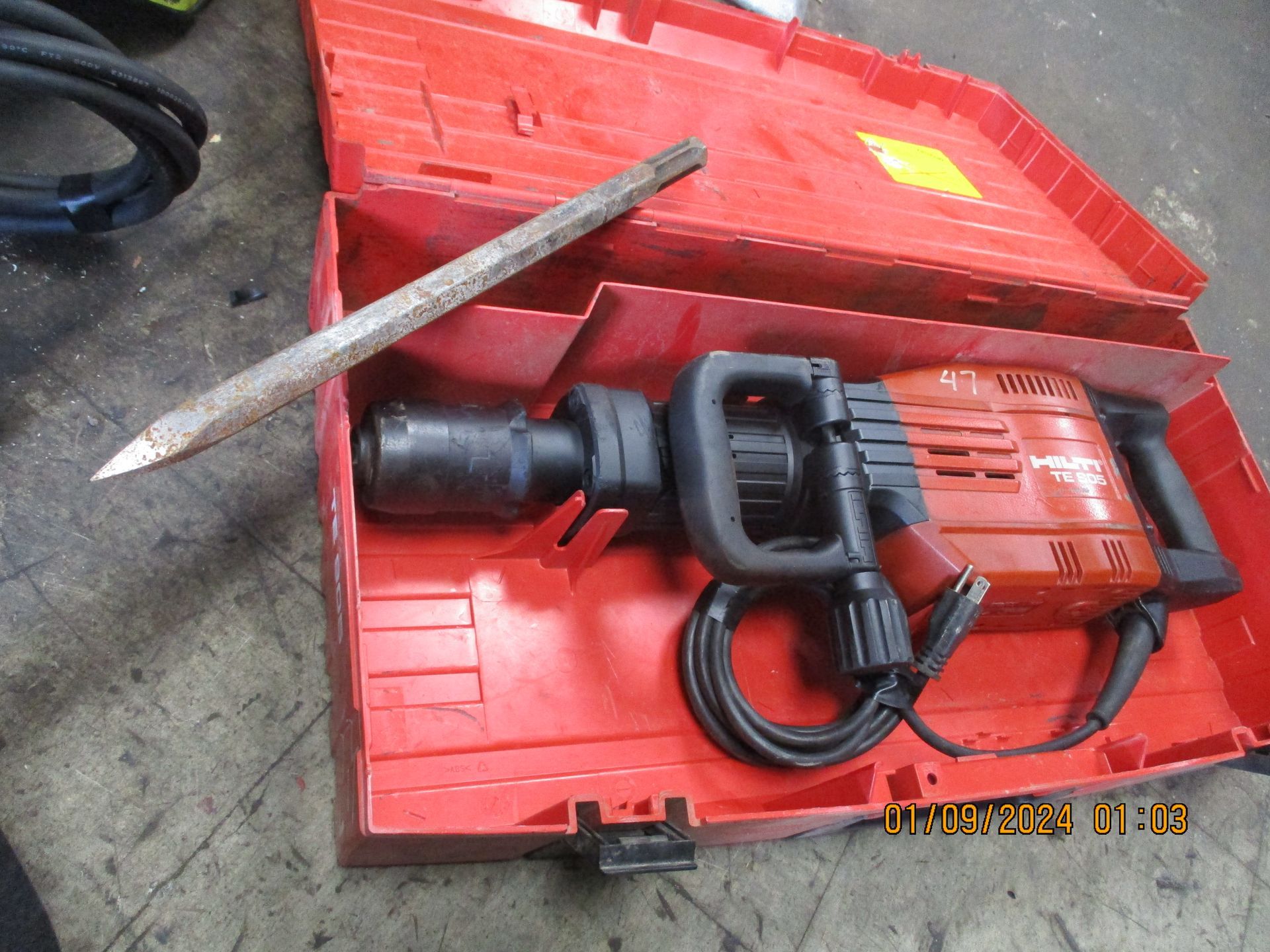 A red case with a hammer inside of it