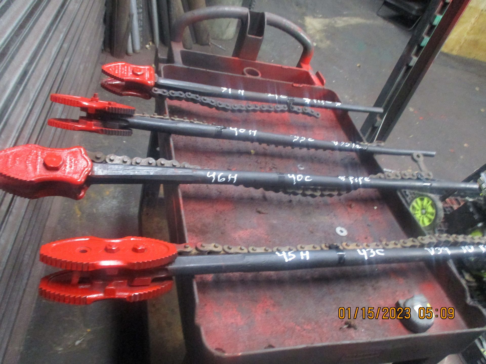 A red cart with a bunch of red tools on it