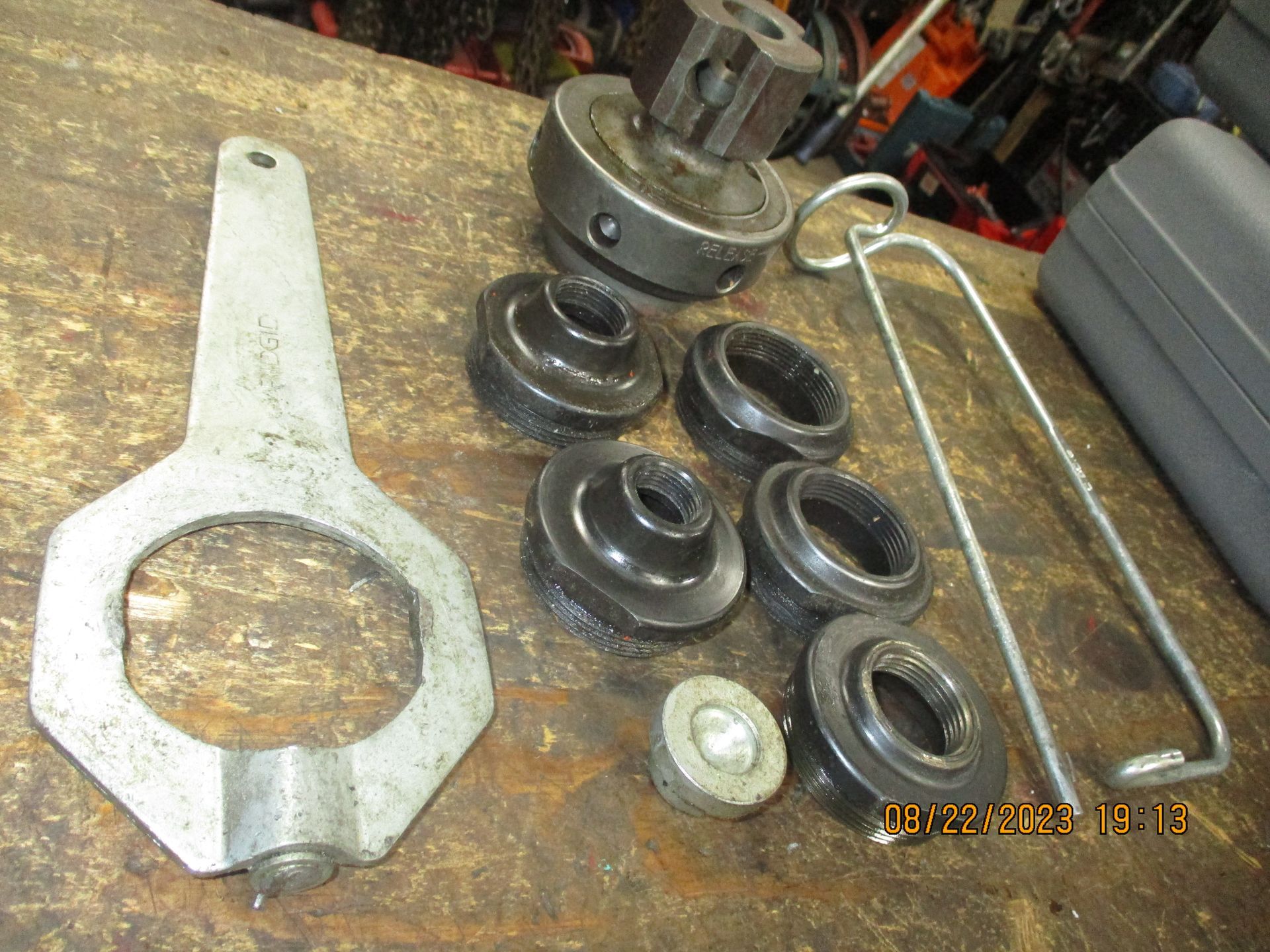A bunch of tools are sitting on a wooden table