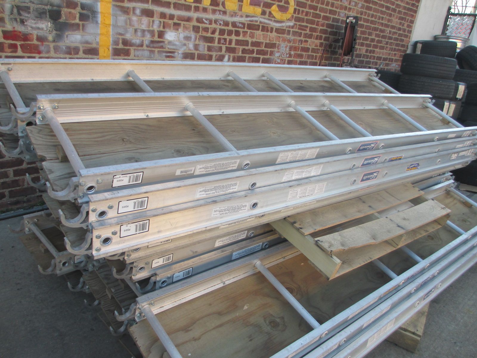 A bunch of ladders are stacked on top of each other