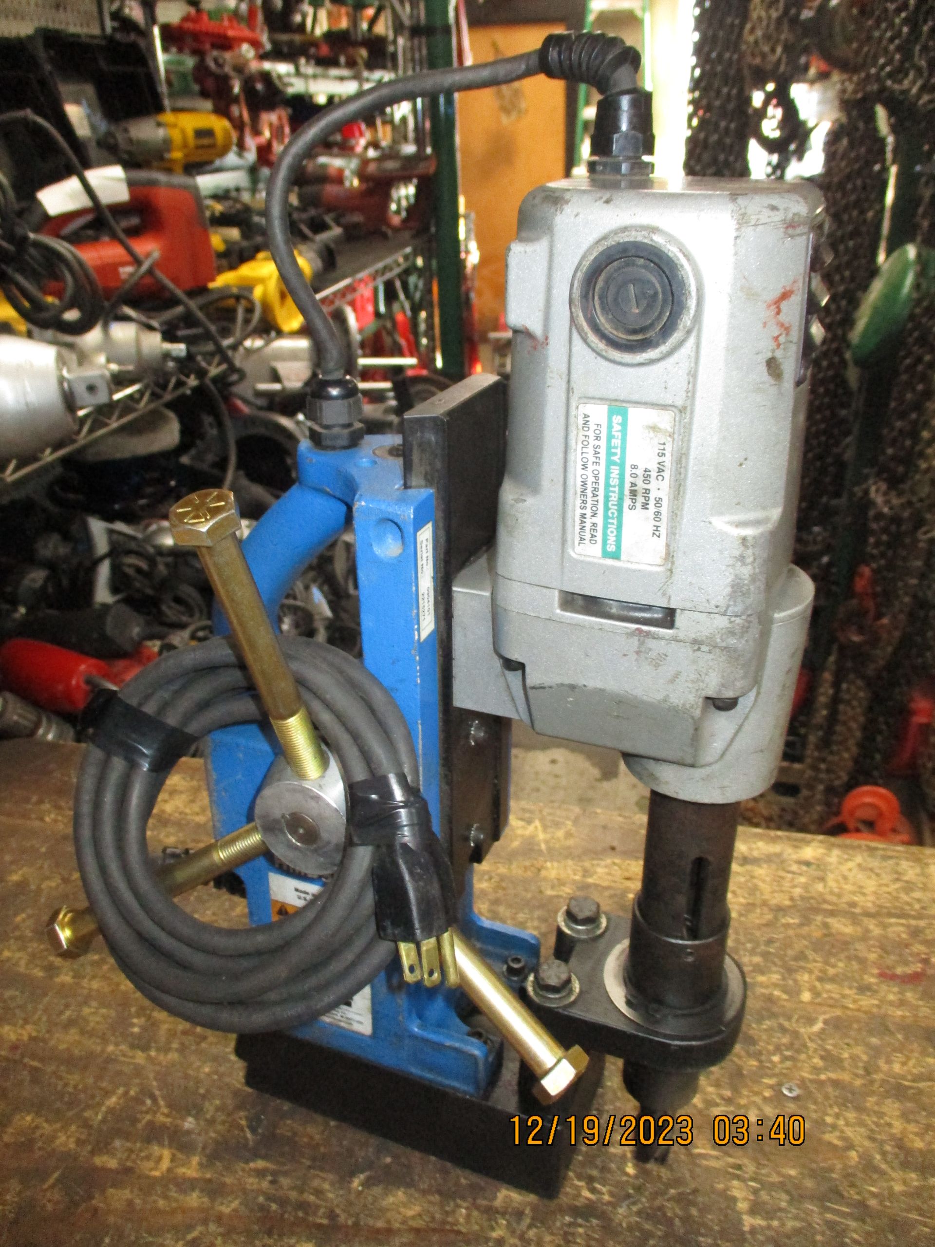 A machine with a cord attached to it sits on a table