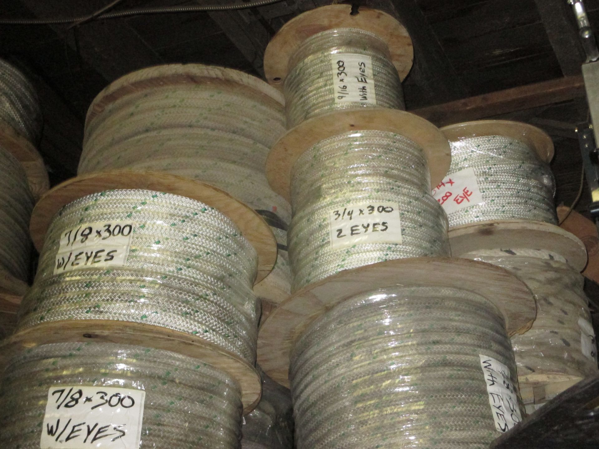 A bunch of spools of wire are stacked on top of each other