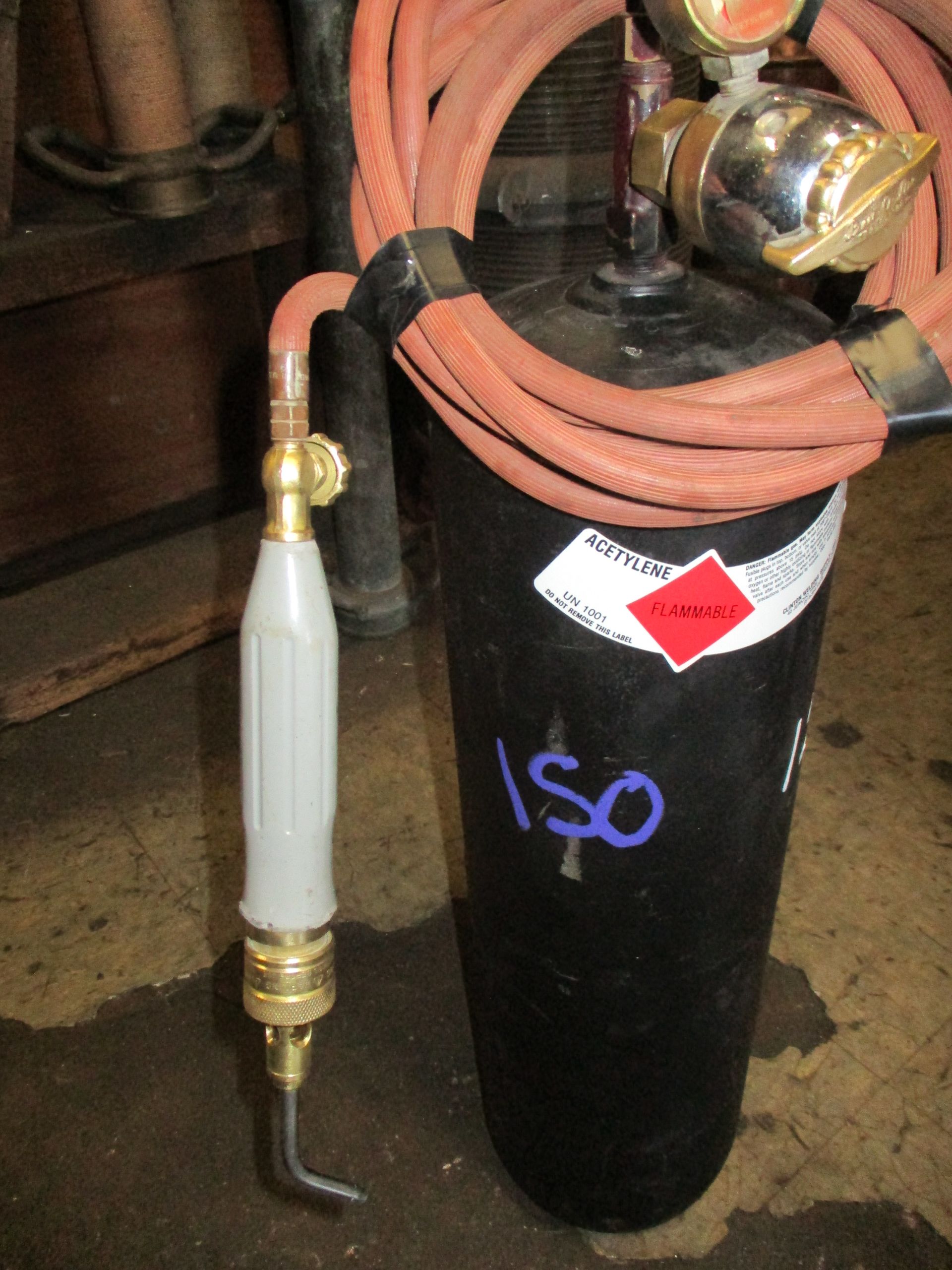 A black cylinder with iso written on it