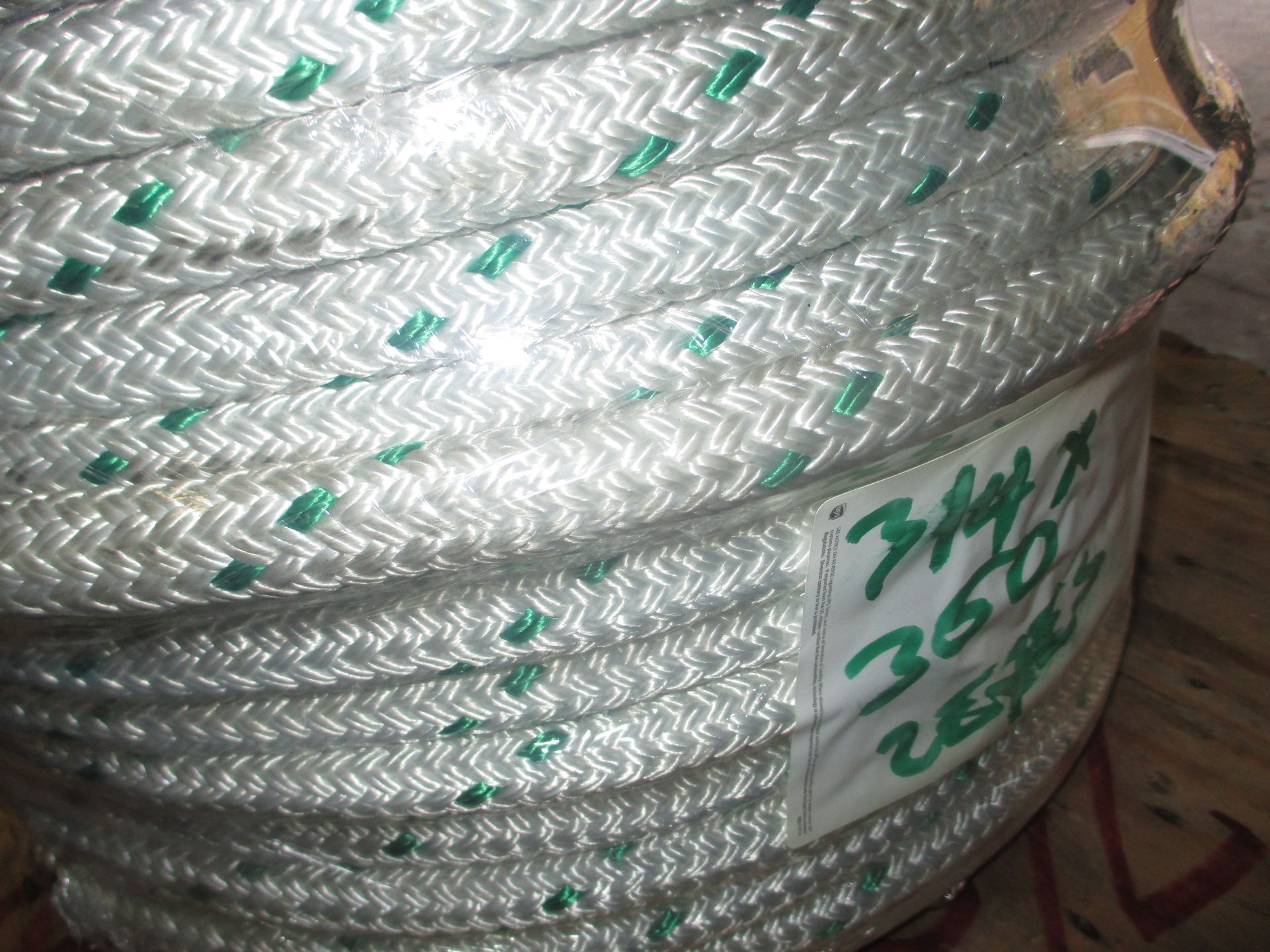 A spool of white and green rope with the number 350 on it
