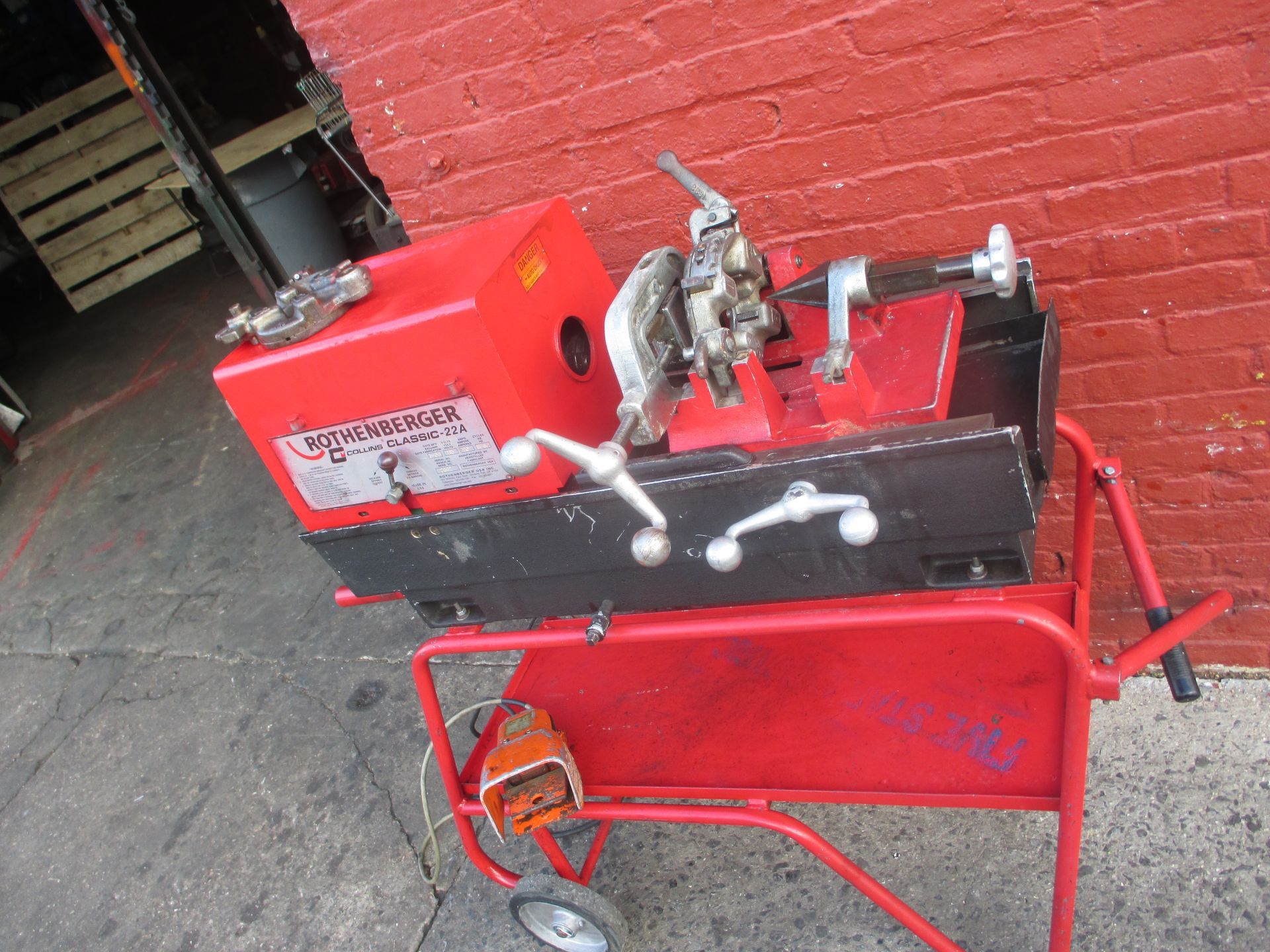 A machine that says dragon on it is on a cart